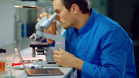 male scientist  microscope  lab lab stock footage sbv