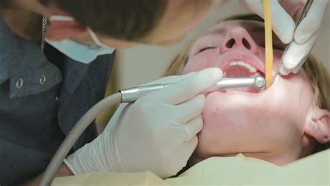 close up of dentist using dental drill on patient s teeth stock footage video 4173580 shutterstock