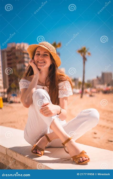 Redhead From Spain Dressed In White With A Straw Hat Smiling At The
