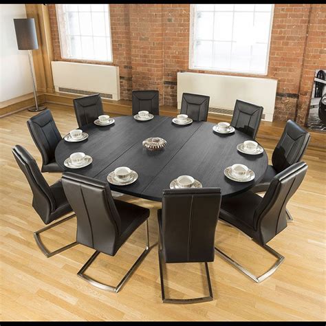 large oval xm dark black oak dining table  deep black chairs