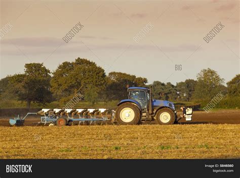 tractor plowing image photo  trial bigstock