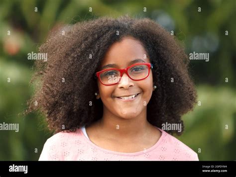 Cute African American Girl Smiling In The Street With Afro Hair Stock