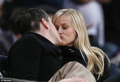 reese witherspoon and jim toth kiss and cuddle like two