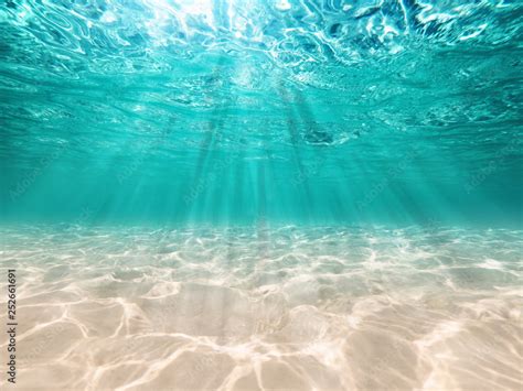 underwater background deep blue sea  beautiful light rays  sandy