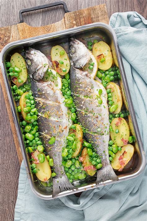 Whole Baked Sea Bass With Potatoes Broad Beans And Peas