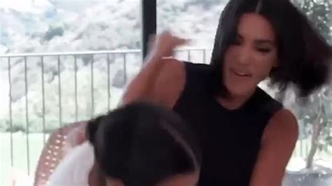 kim kardashian hits sister kourtney in the face metro video