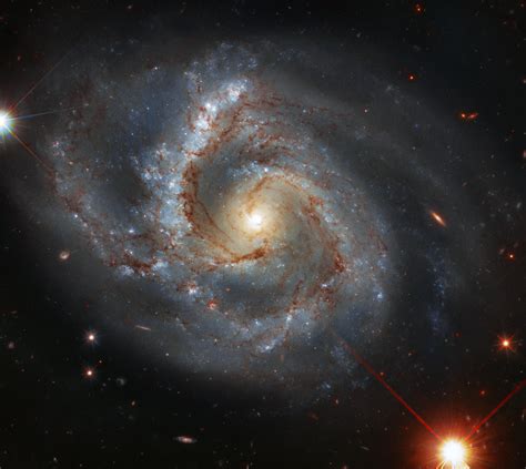 image hubble spots  galaxy   peculiar arm
