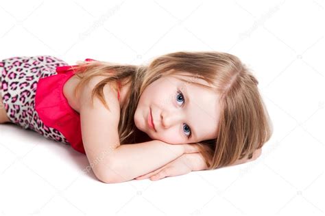 little blonde happy girl in pink swimsuit lying on the floor — stock