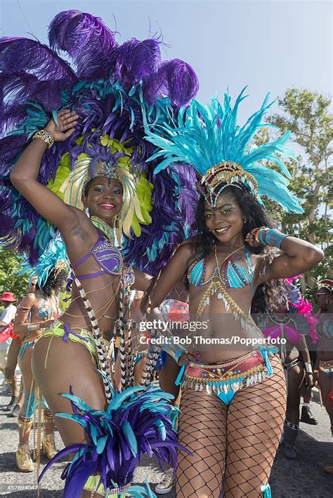 Two Local Bajan Girls Wearing Colourful Costumes During The Crop