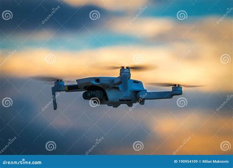 small camera drone flying  cloudy sunset stock image image  blue flight