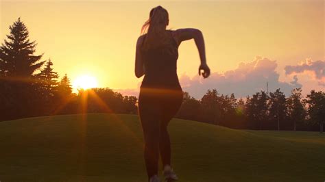woman running   sunset young woman running sunset fitness woman