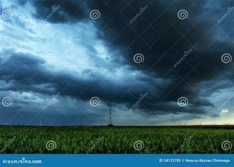 storm clouds flying  field stock image image  green majestic
