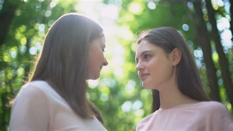 Lesbian Couple Talking Intimately Kissing Stock Footage