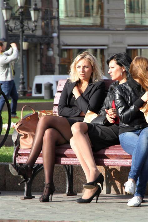 a blonde and brunette sit with their legs crossed in candid pantyhose candid legs street legs