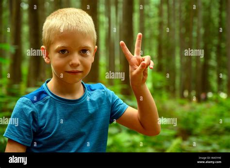 Bright Summer Portrait Of A 6 Years Old Naughty Blonde Haired Caucasian