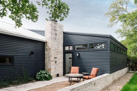 mountain living contemporary farmhouse ranch house garage doors root exterior patio