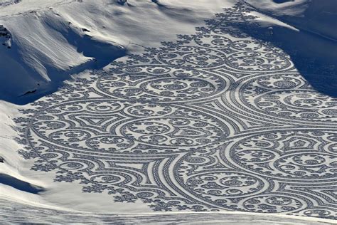 artist creates massive murals  snow    world