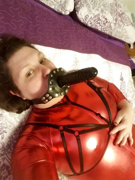 shiny red catsuit zenati gas mask harness strapon 17