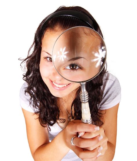woman    magnifying glass momentum real estate group