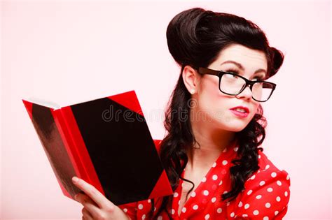 Retro Pinup Girl In Eyeglasses Reading Book Stock Image