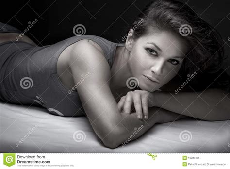 brunette laying on her bed stock image image of erotic 19034185