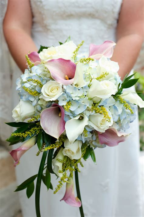 a recent wedding in june featuring calla lilies and hydrangeas floral