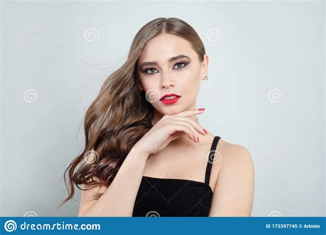 Elegant Woman With Blowing Long Brown Hair And Red Lips