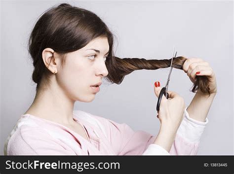 woman is cutting her hair free stock images and photos 13813445