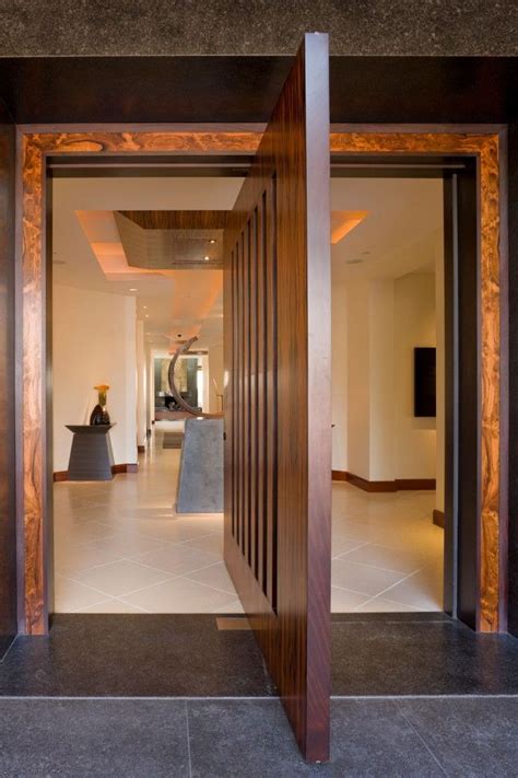 entry pivot door  ebony  brazilian rosewood interior design  matrix design studio