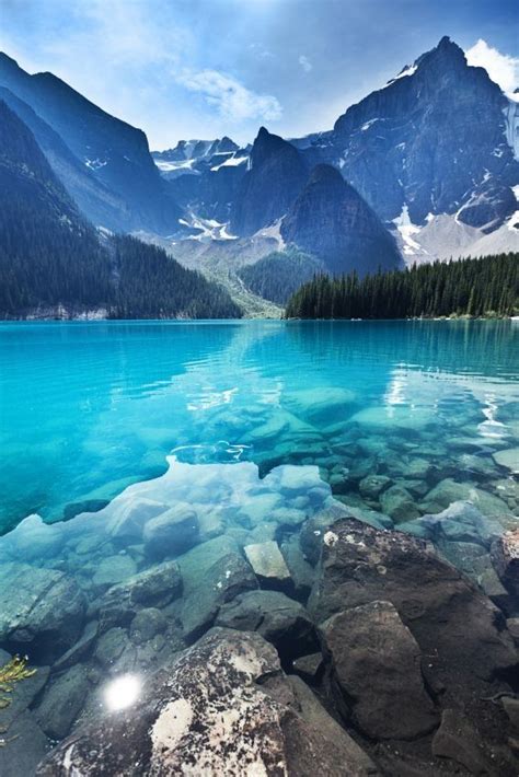 the teal blue water of moraine lake in banff national park