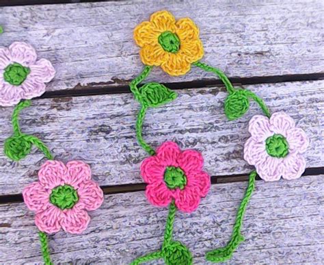 crocheted mini garland   small colorful flowers yellow pink white