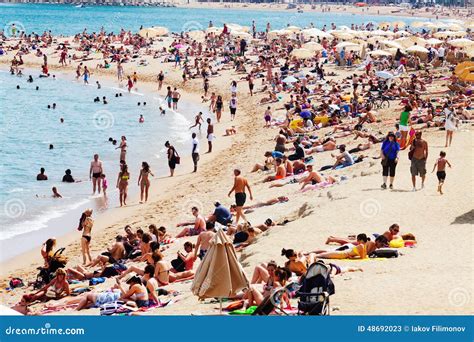 people sunbathing  mediterranean beach editorial stock photo image