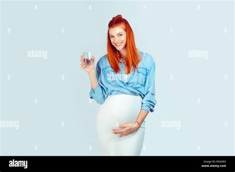 Cheerful Ginger Woman In Dress And Shirt Being In Pregnant And Holding