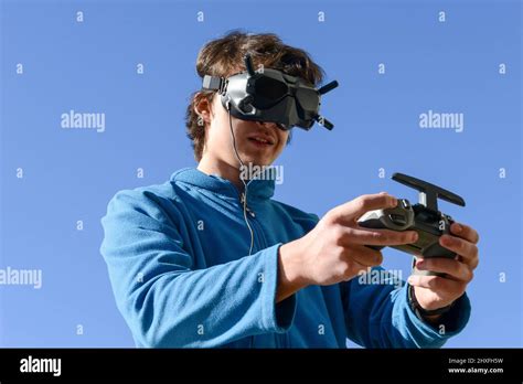 teenager  googles  controller flying  drone stock photo alamy