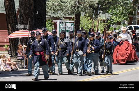 Members Of A Civil War Reenactment Group March Down The Parade Route At