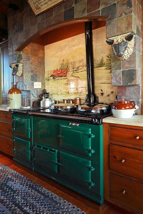 green photograph aga range ovenwith tile scene  stone wall  sally weigand home decor