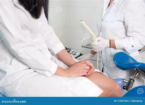 Gynecologist Ready To Do Transvaginal Ultrasound With Wand And Exam A