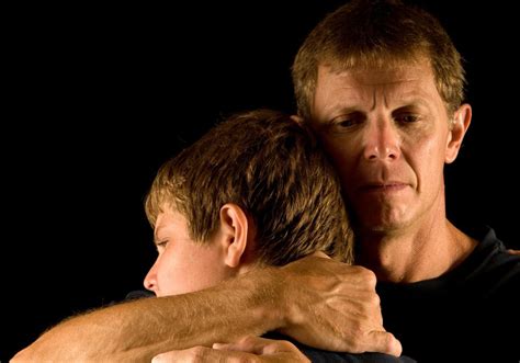 Father Hugs Son Caregiver In The Raw