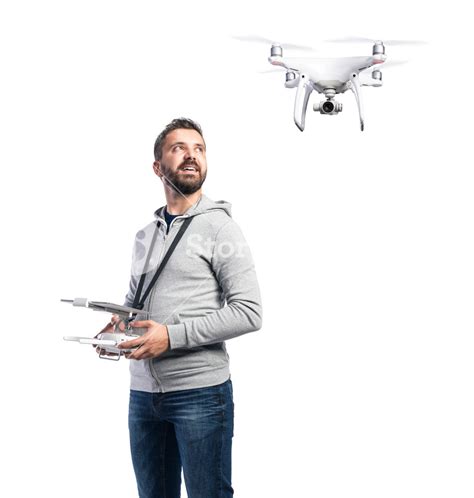 man  remote control  flying drone  camera studio shot  white background isolated
