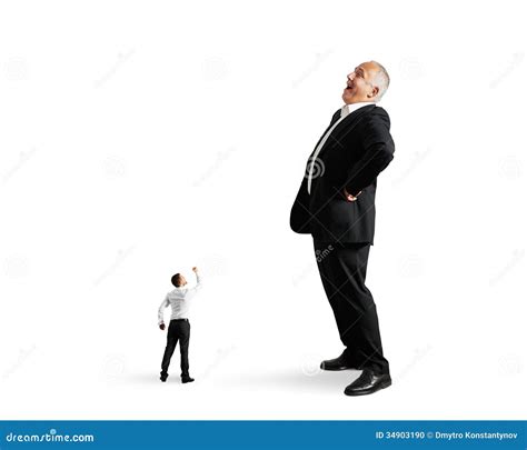 small man showing fist  big businessman stock photo image