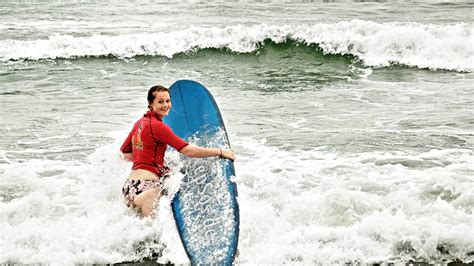 File Surfer Woman Wearing Bikini Bottom And Shirt Png Wikimedia Commons