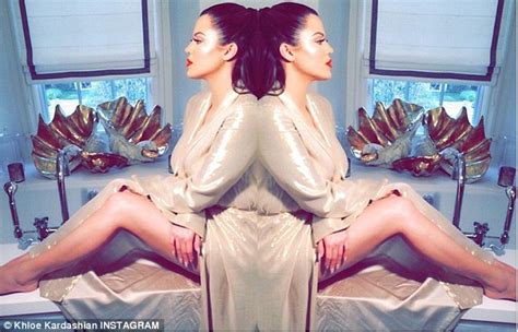 khloe kardashian showcases slim legs in golden dressing gown after