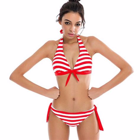 a cute bikini set featuring stripes and cute red bow type bikini