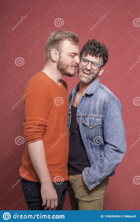 Gay Couple Intimate Cuddling In Front Of Camera Stock
