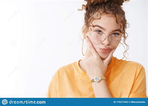 close up confident attractive lesbian girl curly haired ginger hair