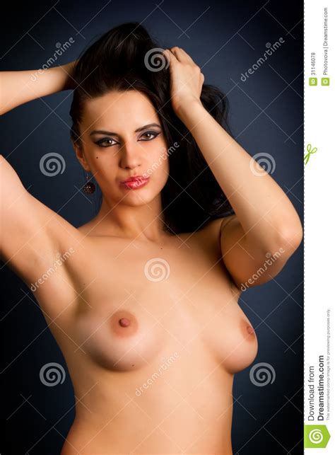 Beautiful Nude Woman With Tan Body On Dark Background