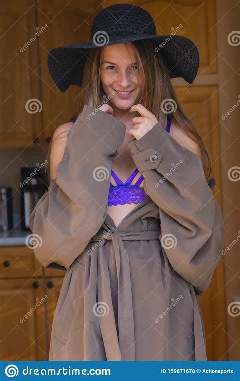 a lovely brunette lingerie model poses in lingerie in a