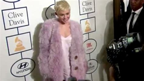 miley cyrus wraps up in lilac fur coat at the pre grammy clive davis