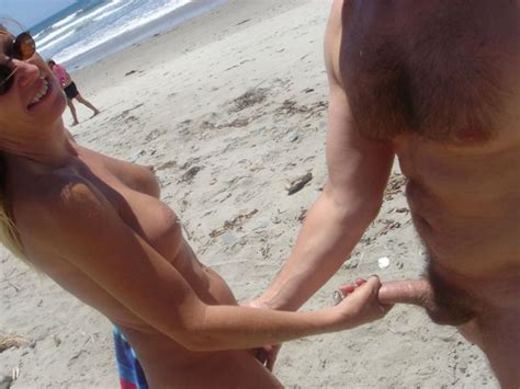 Wife With Round Breasts Stroking Cock At Nude Beach Photo 2