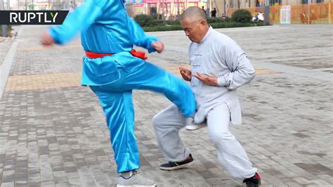 chinese kung fu master shows off his balls getting hit kicked and rammed world of buzz